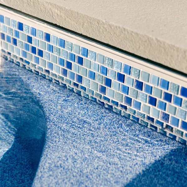Glass tile for a fiberglass swimming pool