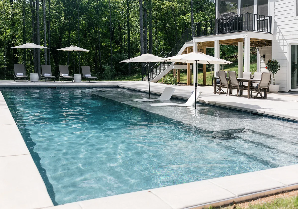 Christmas time outdoor living space in front of a stone fireplace