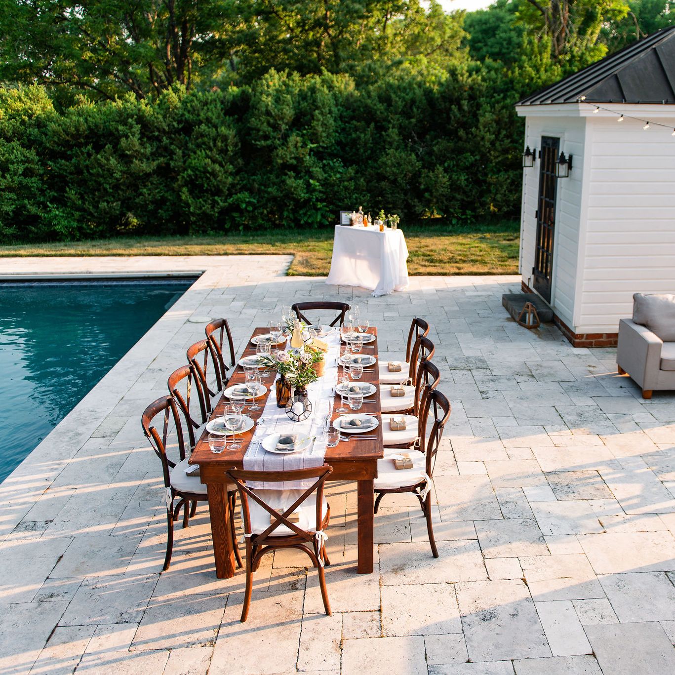 Rectangular pool with travertine pool decking