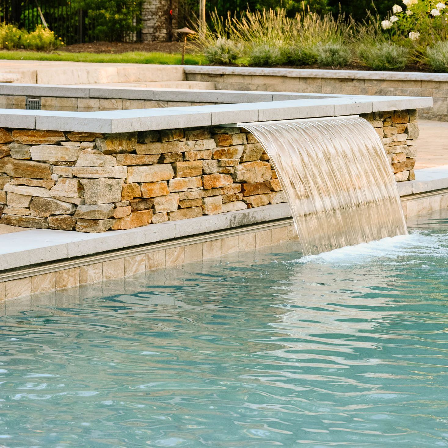 Hot Tub water fountain leads into the pool