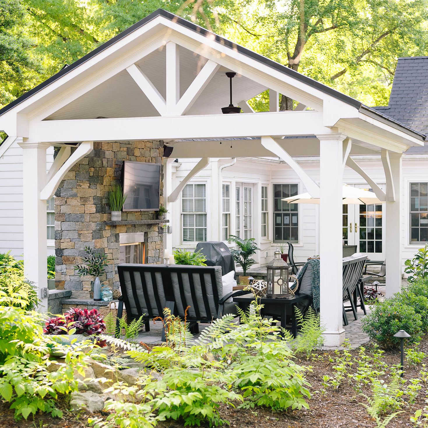 Beautiful white pavilion covering backyard patio