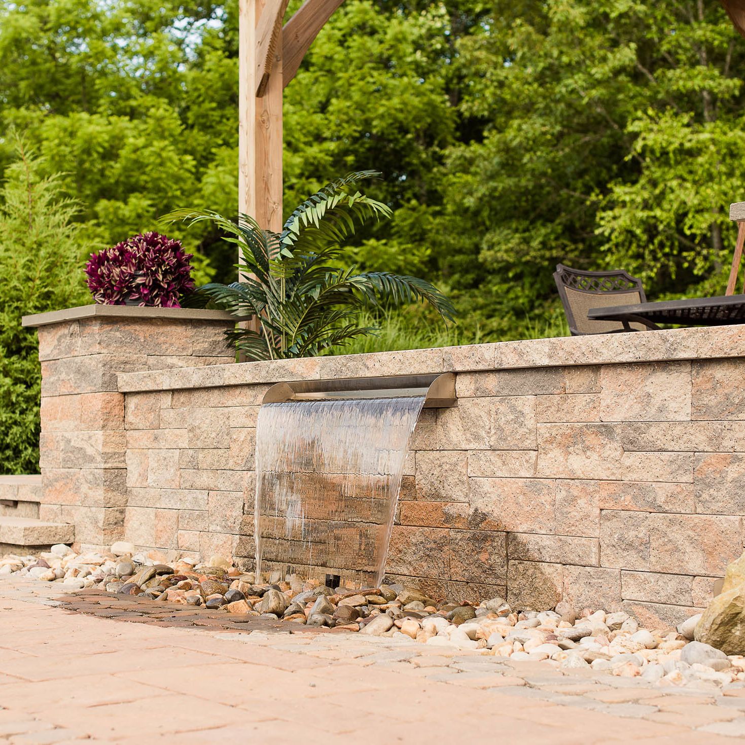 Paver patio with wall fountain