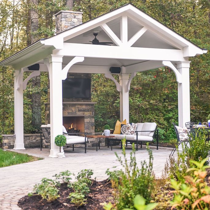 Paver patio with pavilion and outdoor fireplace