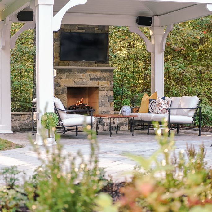 paver patio with pavilion, outdoor fireplace, outdoor television and outdoor speakers