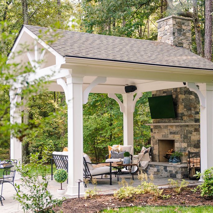 paver patio with pavilion and outdoor fireplace